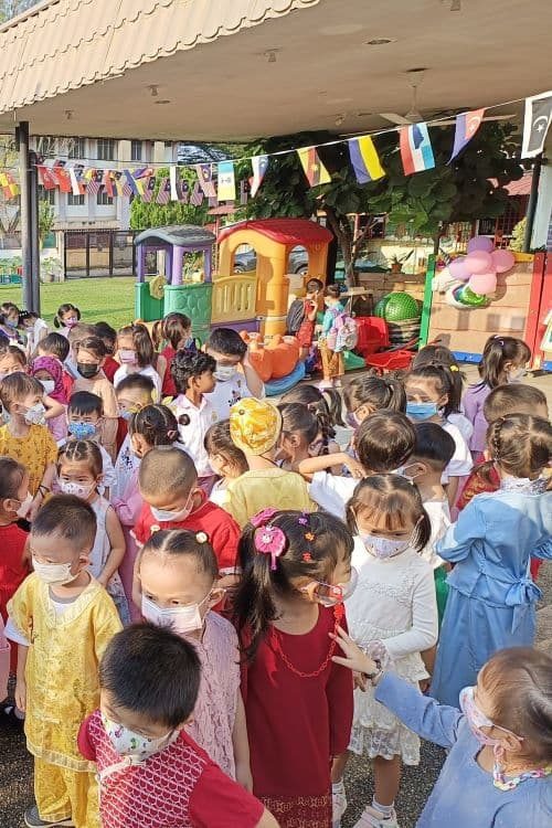 Children in traditional outfits celebrating Malaysia Day at TDJ
